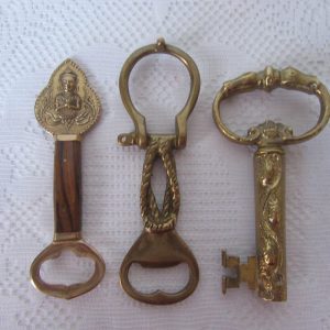 Bottle openers and corkscrew. Choice of 3. Brass and wood handle siamese design.Brass Rope/knot d/link design.Brass and metal Key corkscrew.