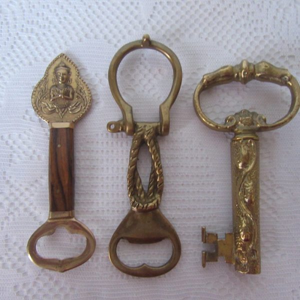 Bottle openers and corkscrew. Choice of 3. Brass and wood handle siamese design.Brass Rope/knot d/link design.Brass and metal Key corkscrew.
